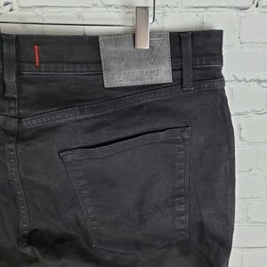 GUESS | Vermont slim fit low rise tapered leg jeans